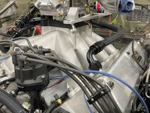 Left crankcase breather hose and throttle linkage bracket