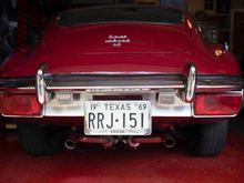 Such a beautiful car, such an awful rear end treatment.  I raised the plate, deleted the reverse lights, replacing with less. Decided to brush the chrome between the lights.