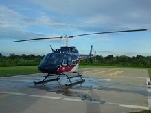 N19AE at AE 75, Dyersburg, TN.
Blades untied and ready for action.
N19AE is a Bell 206-L1, with the power pack.  It was rebuilt to an L3 performance specs by Air Evac.