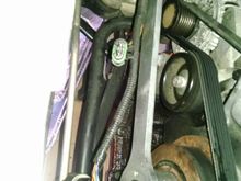 I am removing the crankshaft bolt.  I braced the tool with a piece of wood as shown.  I used a two foot long 1/2" drive breaker bar with a two foot pipe slid over the end.  You need at least three feet of leverage.