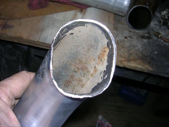 Ovaled end of pipe to match flange