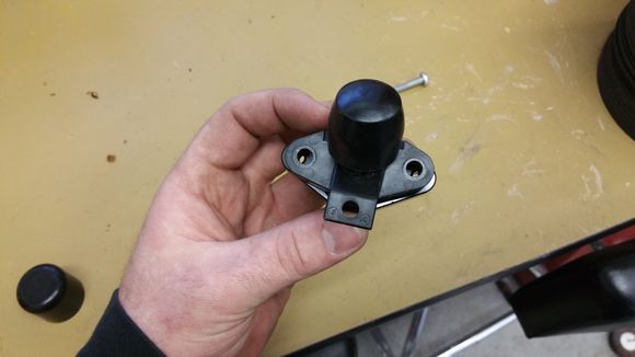 Oem piece with a vacuum cap on top of the focus block off plate so you can see the size difference
