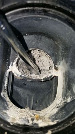 I used a flat head screw driver to see if I can easily remove that stuff.