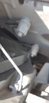 Passenger side (LHD) behind headlight 2006 XJ8.