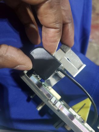 I didn't want to fully rid of this aluminum part. I  lined the camera to trace around it..then used snips to cut it out. I made remove the case of the camera also. Its sealed inside and has half and inch of hollow space. Plus it will not be exposed to the weather.