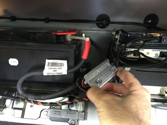 23. Two bolts come out to free the bracket.