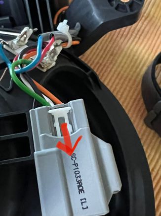 Release by pushing forward the locking tabs on both side and remove white plastic bit completely. Remember to reinstall later