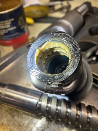 The ball bearings are held to the inside of the piston by grease