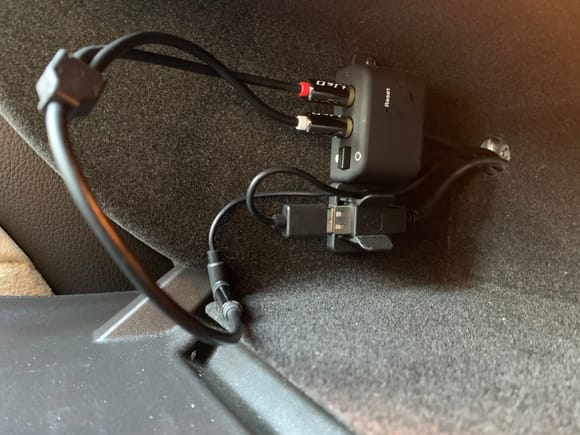 Cables routed into glovebox and plugged into connectivity module.