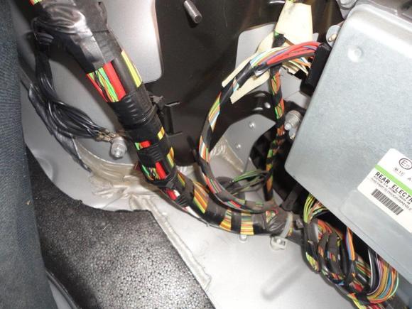 Rear Electronic Module In Right side of trunk (boot) behind carpet.  Note the two ground studs