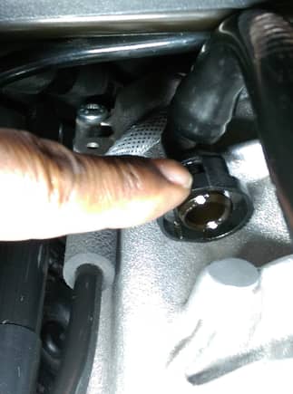 The best way to remove this  tube is to release it from the throttle body, then while pushing it back, release the squeeze couple by pressing on one side at a time.