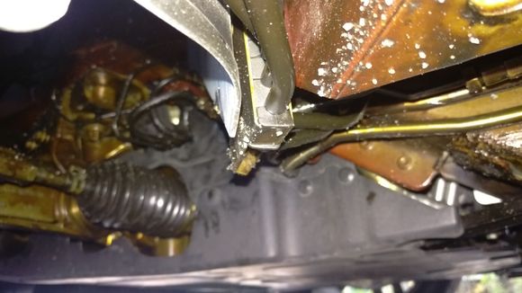 Camera position just behind left front wheel looking 45 degrees forward. The brownish stuff is the anti-corrotion material.