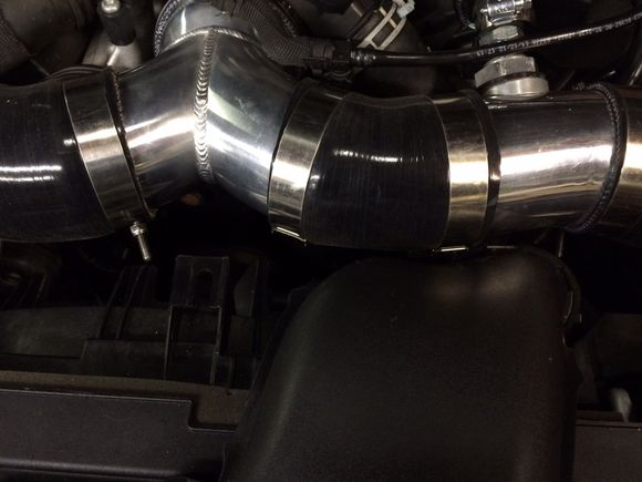 The 3.75" to 3.5" reducer has about 1/2" of length cut off the 3.5" side to clean up overhang once the "t" pipe depth was set to clear the supercharger snout.