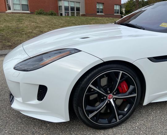 It was the calipers on my first F-Type that I painted and added new decals.  This style rim allowed me the space to pull it off without removing the wheel but I still had to move the vehicle a few times.  Would not attempt it with the rims on my newest F-Type.