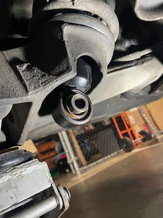 Bottom of the shock protruding through the suspension arm.
