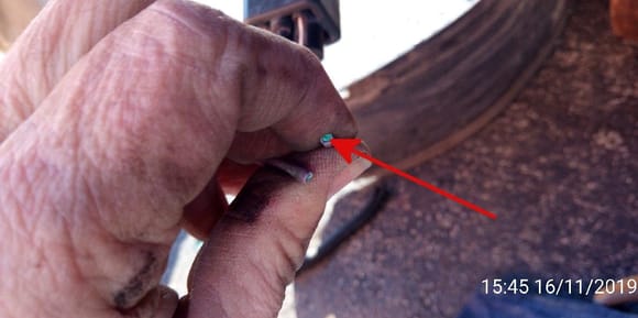 arrow pointing to corrosion on ends of the broken wire