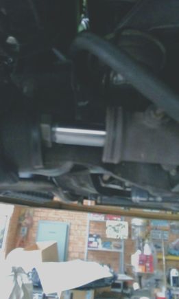 Unclipped the metal clamp, pulled the steering boot to the side exposing the rack and inner rack end 