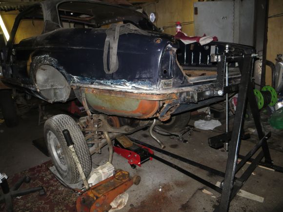 The back on the jig as well I disconnected the subframe, removed the exhaust except for the over axle pipes then wound it onto the rotisserie. 
I have removed the tanks as well one actually had rusted through severely and been bodged with filler.