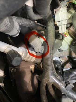 On the passenger side of the engine bay is this quick coupler. It to is also part of the octopus hose. It can crack and drip coolant on top of the passenger side catalytic converter and evaporate the coolant before hitting the ground.  