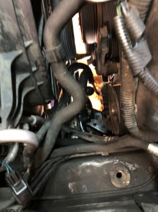 Left hand side. Sorry about the poor quality of the picture, you can just see the bolts roughly in the center of the picture.