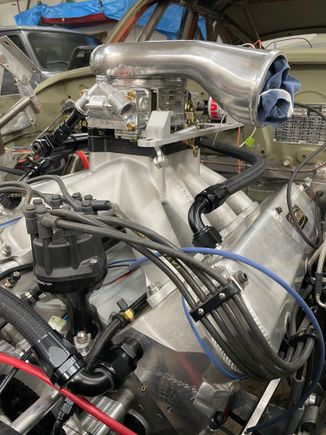 Left crankcase breather hose and throttle linkage bracket