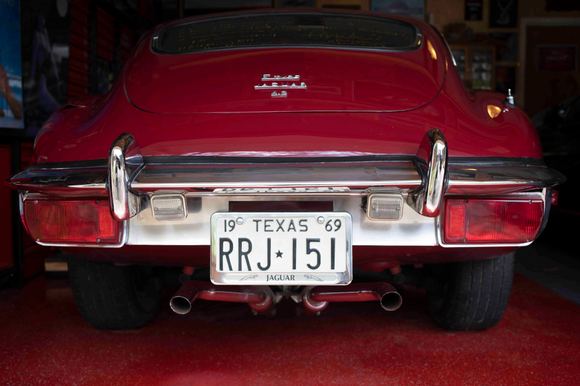 Such a beautiful car, such an awful rear end treatment.  I raised the plate, deleted the reverse lights, replacing with less. Decided to brush the chrome between the lights.