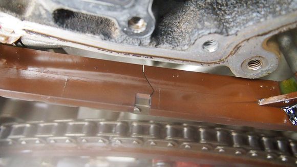 Cracked slipper guide and failure of the left (passenger side) primary timing chain tensioner