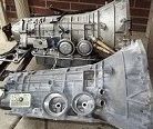 BOTH 5R55N TRANSMISSIONS (THE JAG IN THE FOREGROUND IS ALREADY STRIPPED