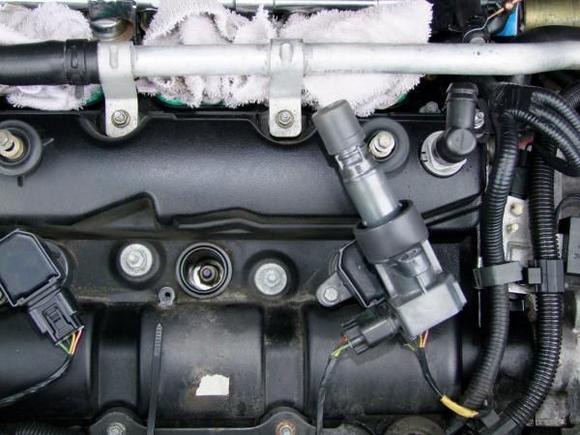 Step 11
Just a shot of the plug, make sure your spark plug socket has the rubber grommet in it to grip the plug and is securly in it, you can test it with the new one.