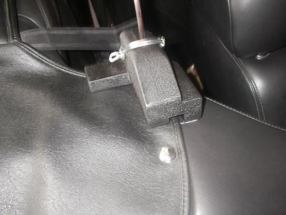 jag wind deflector.... Here is a close up or the side bracket. The top cover slides under it easily. I designed and fabricated the bracket and it is held on with Dual Lock (a super velcro), and the lexan is held with a clip pin.