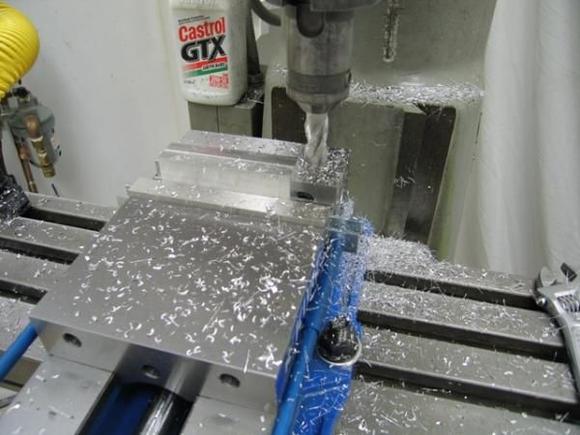 During the first fit of the trunk lid, i discovered that the gas strut, while easily attached to the aluminum hinge, had no place to attach to the body.  Rather than bend up a kludgey metal tab, and since any "billet aluminum" parts are always revered by all, i decided to design and build a "simple" strut mount.  While a nice diversion from the true task at hand, like everything else i do, it took way more time than i thought!  After i made the sketches, i started with my little billet piece.