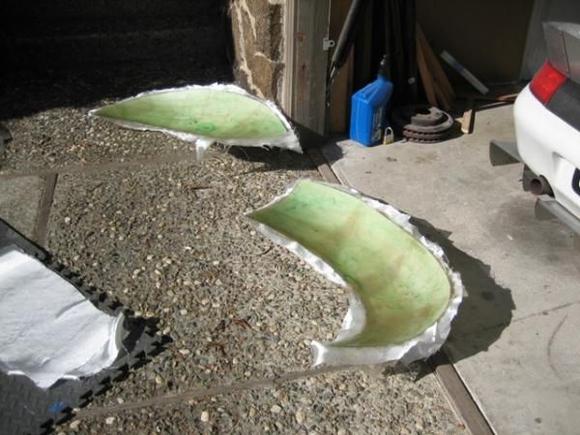 2
This is the process of laying up the widened front fenders.  Both and done and curing in the No. CA sunshine (a good thing it was sunny because the hills of Oakland do not get very warm in January!).