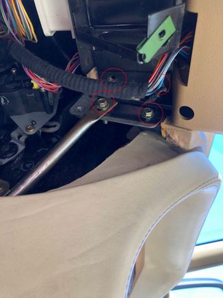 Under the dashboard right of the steering wheel