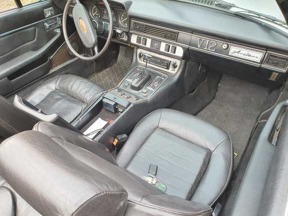 It definitely needs some work: new mats, removing the emblems and maybe a wood trim.