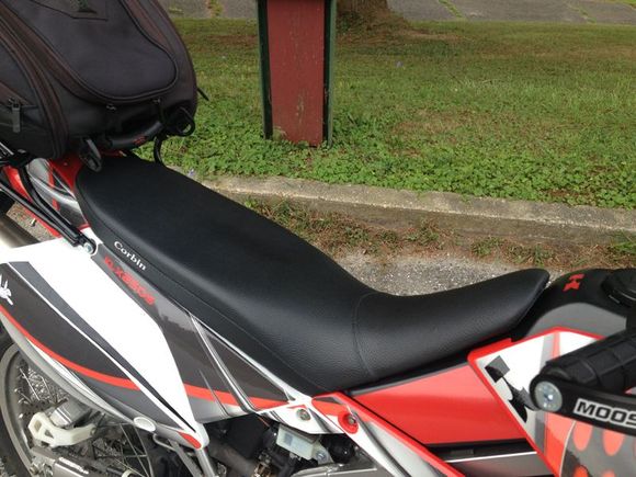 The stock seat was horrible for more than 30 minutes of riding at a time. The new Corbin seat is a tremendous improvement.