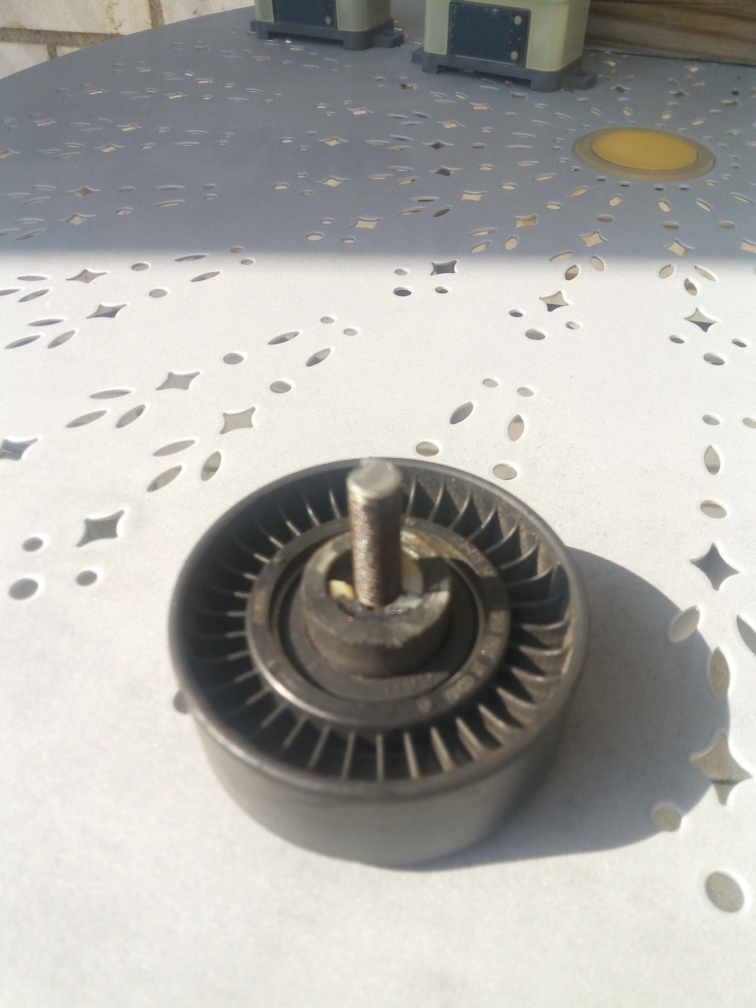 smooth idler pulley broke off leaving stud in place on 2.5 engine