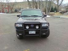 Came with grill guard and off-road exterior lights.  Lights are operated by a foot switch (on of the old dimmer switches).