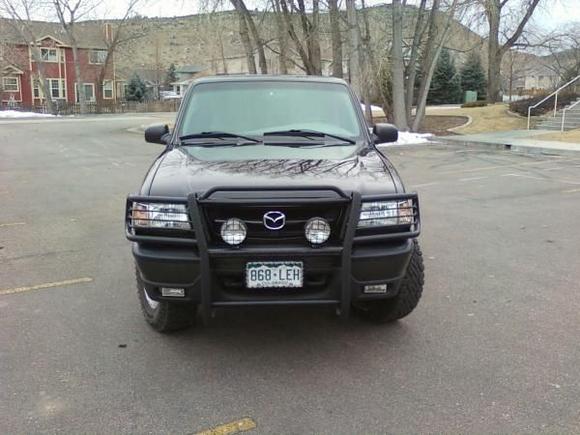 Came with grill guard and off-road exterior lights.  Lights are operated by a foot switch (on of the old dimmer switches).