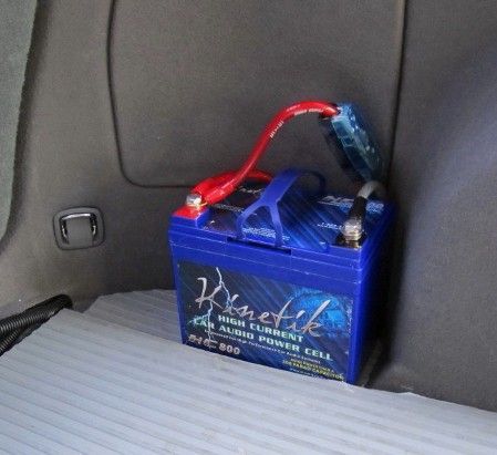 Kinetik Car Battery in Rear.
Must have Fuse/Breaker before this battery and also at front main battery as a safety precaution if you ever get T-Boned from side