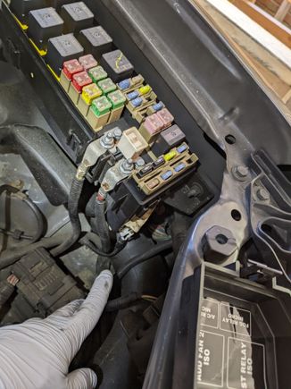 Disconnecting primary fuse box. Those two big wires and an electrical connector