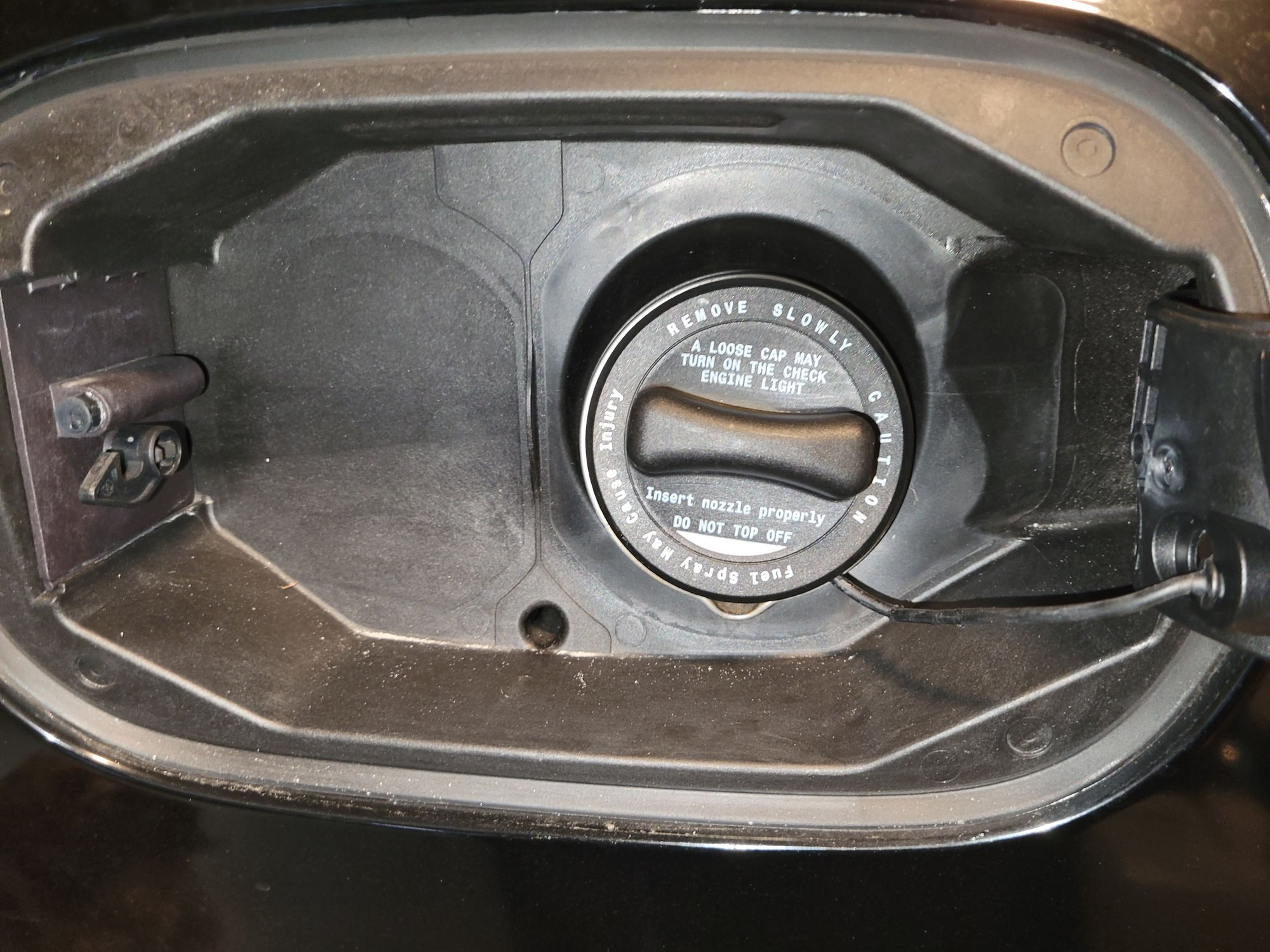 Fuel cap tether is detached from car Forums