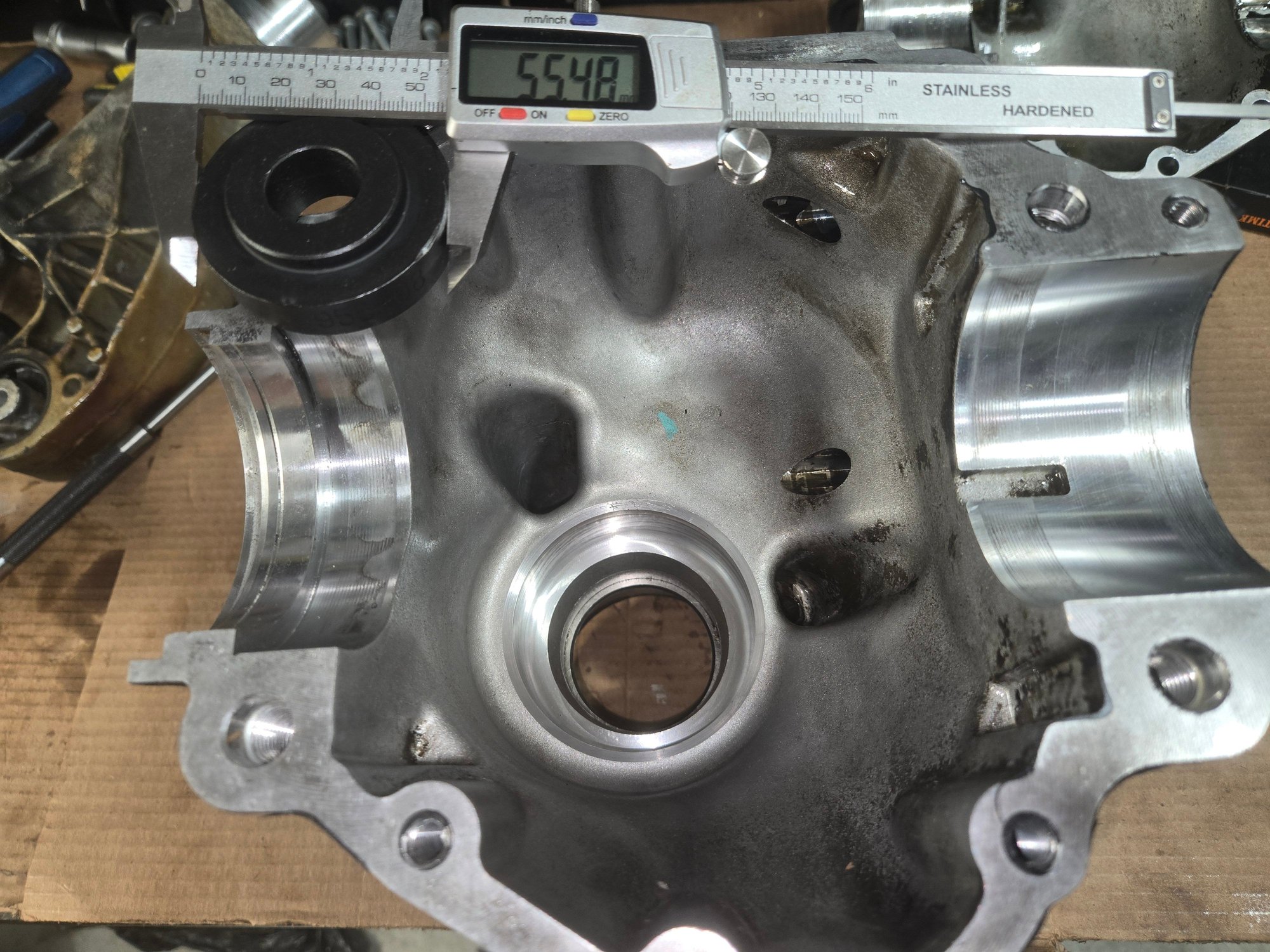 Preparing to press out the outer bearing race at the flange end of the pinion housing.