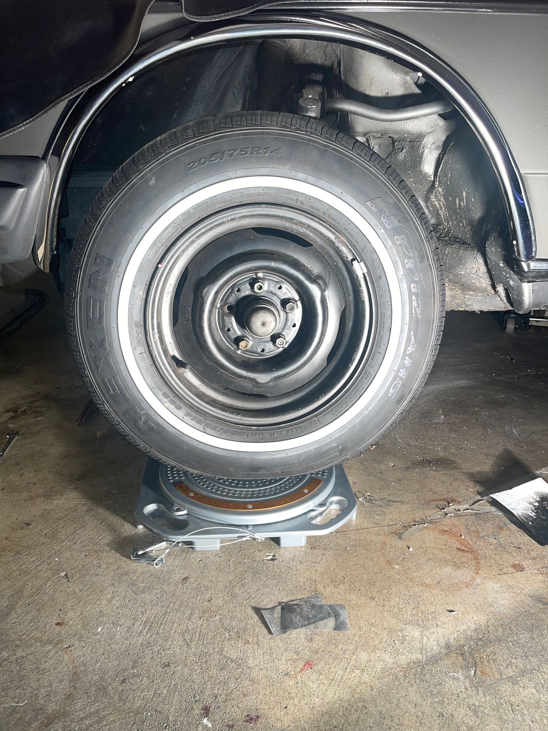 Wheel not centered within wheel well.