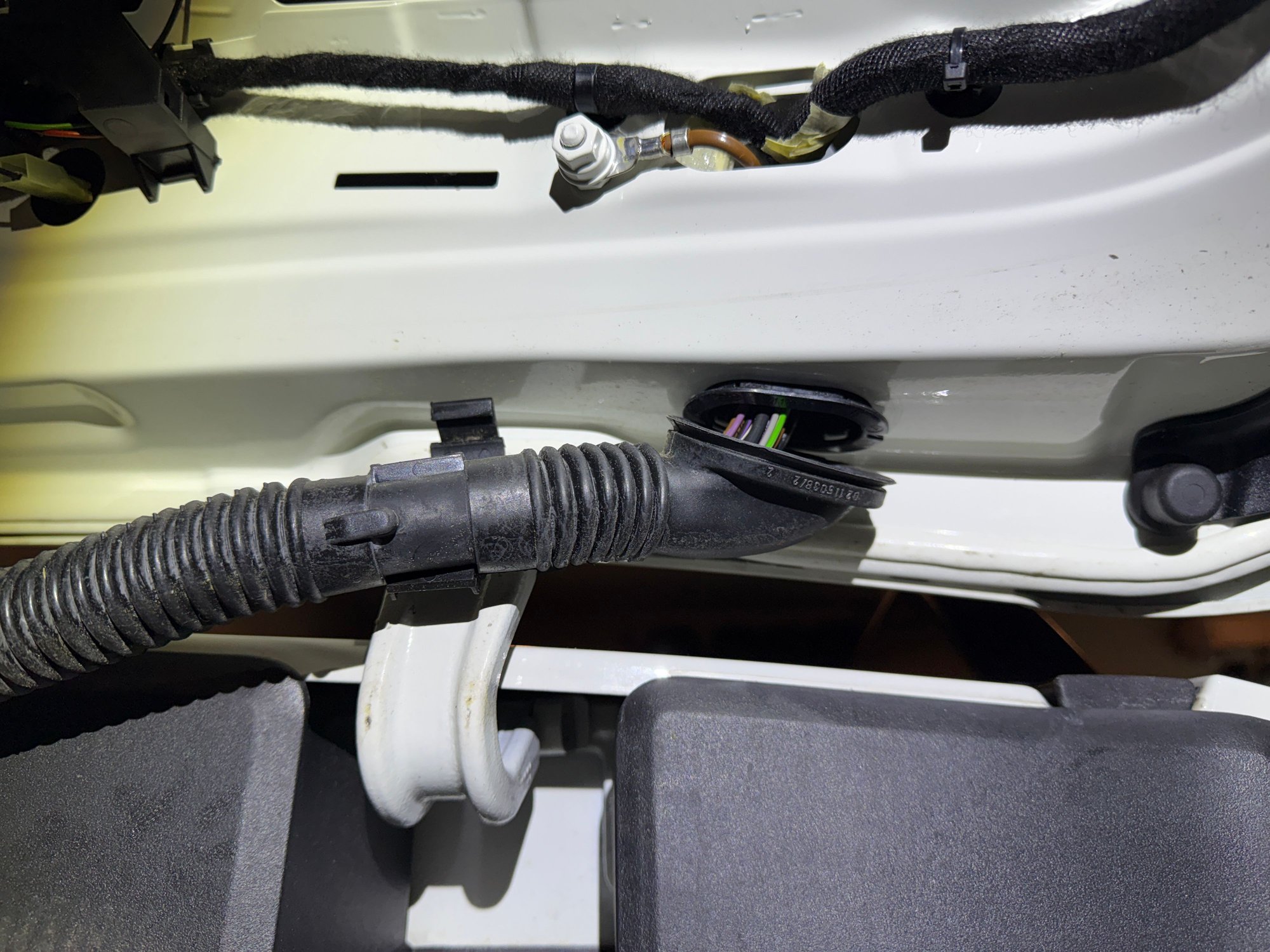The rubber boot that the electrical wiring loom has to be routed through. 