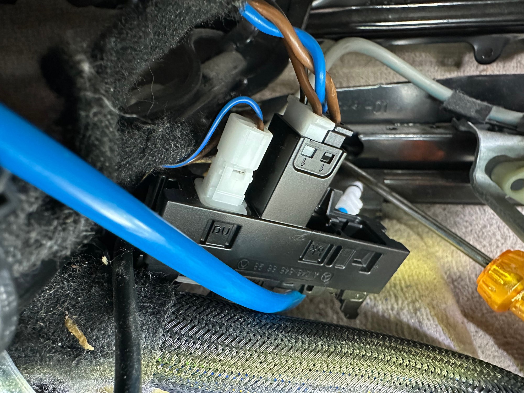 Push this plug toward the front if the car - it pops out and you have more room 