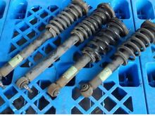 These are sl350 springs and struts. Above the possible different spring rates it appears the lengths and sizes at each end may be wrong, they certainly look different. 