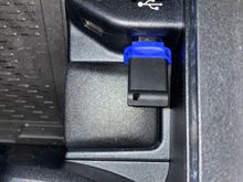 This is what I use, but I usually put it in the center armrest USB-C port.  It records the dash cam and I play songs from it.
