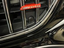 AMG emblem carrier wrapped in metallic red.