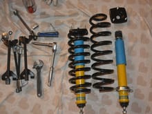 I had to use 4x spring compressors as these coil springs are long and thin. Top mounts and springs are also Bilstein.