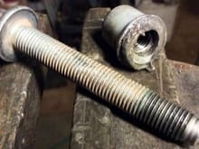 Bent bolt and thread stripped on locator